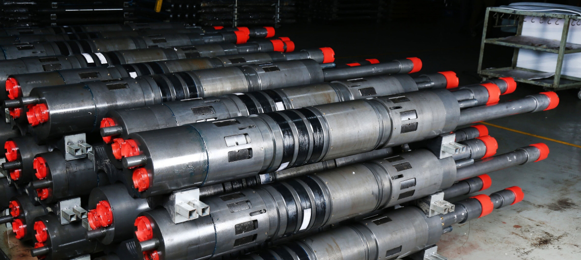 A warehouse shelf stacked with specialized drilling and maintenance tools.